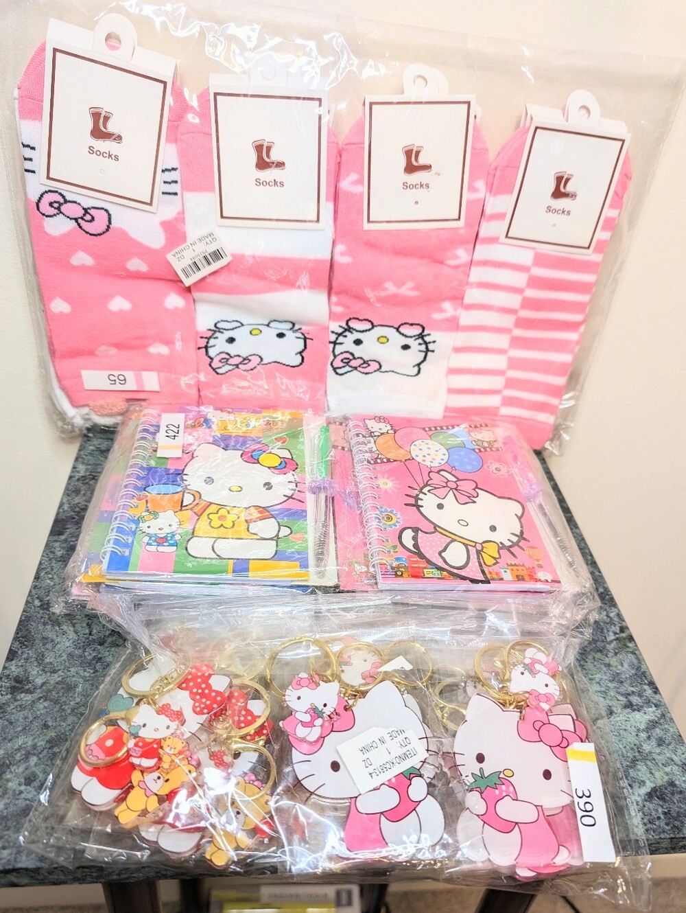 Hello Kitty Gift Bundle| 12 Key Chains, 12 Socks, & 12 Mini Notebooks With Pens